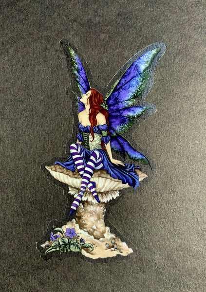 fairy sitting on mushroom