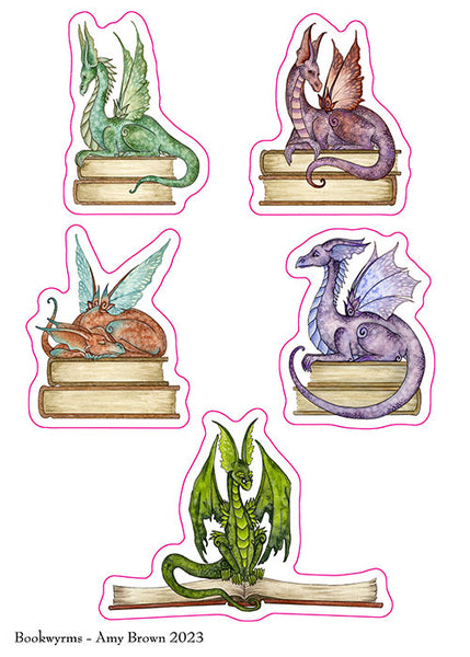 dragons sitting on books