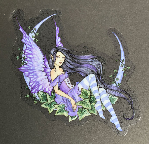 fairy sitting on crescent moon