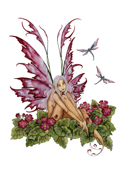 pink fairy sitting in primroses