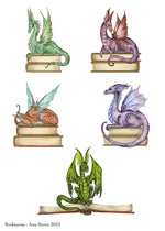 A collection of various dragons sitting on books
