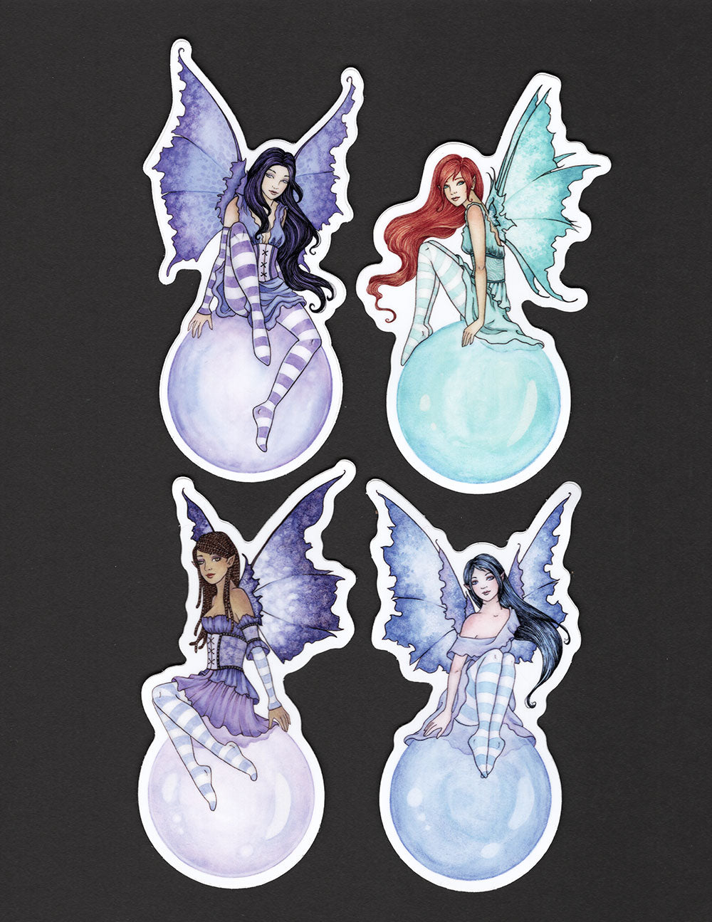 various fairies sitting on bubbles