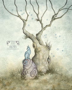 A blue cat sits on a rock under a tree. 