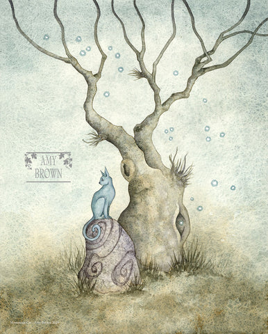 A blue cat sits on a rock under a tree. 
