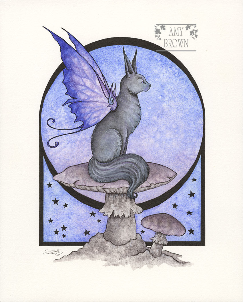 gray fairy cat sitting on a mushroom