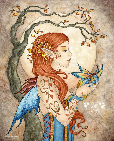 autumn fairy holds a tiny blue and gold dragon